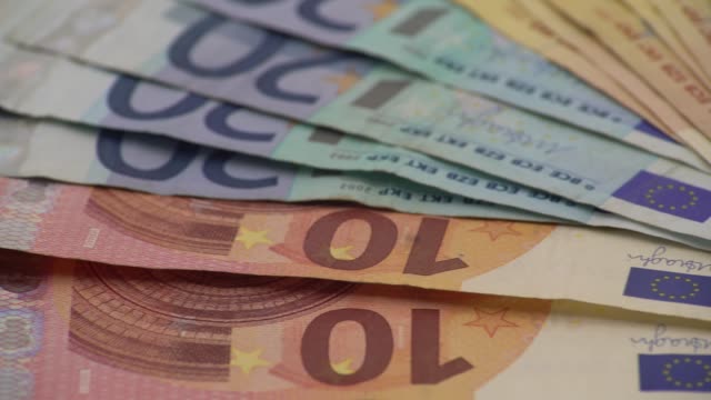 4K-Dolly-sliding-euros-bills-of-different-values.-Euro-bill-of-five-hundred