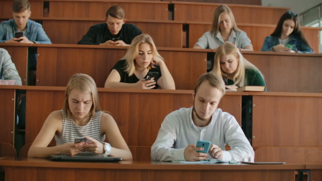 Students-chat-online-in-a-university-classroom.-Introverts-and-fear-of-people