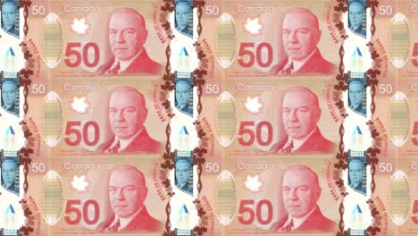 Billetes-de-cincuenta-dólares-canadienses-rodando-en-la-pantalla,-dinero-en-efectivo,-bucle