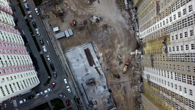 Aerial-view.-Urban-area-in-the-metropolis.-Construction-of-high-rise-residential-apartments-in-the-city.-View-of-the-building-site-from-above.-Sale-and-rental-of-residential-property