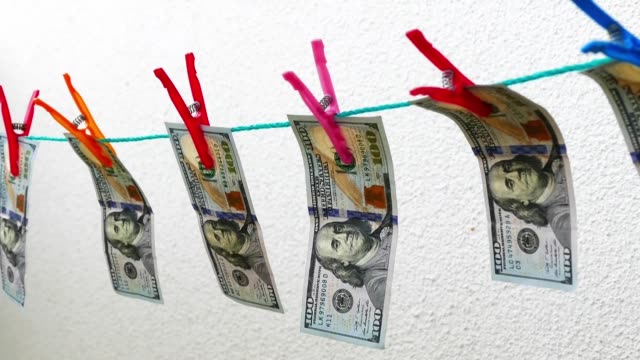 usa-dollars-lined-up-rope