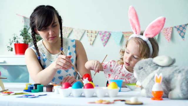 Little-Girl-and-Her-Mother-Coloring-Easter-Egg