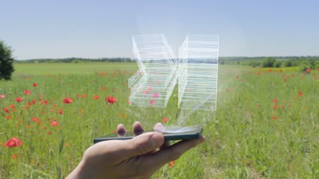 Hologramm-von-Geldstapel-auf-einem-Smartphone