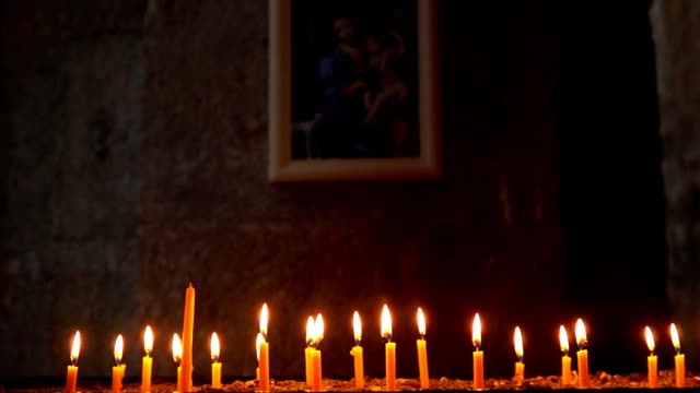 Candles-burning-in-front-of-the-icon