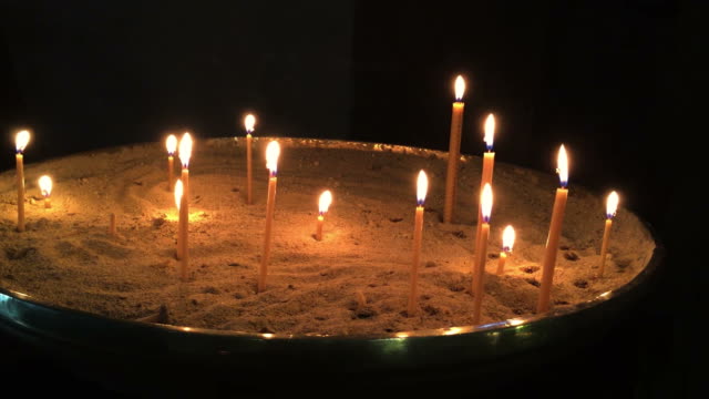 Many-candles-burning-in-church.
