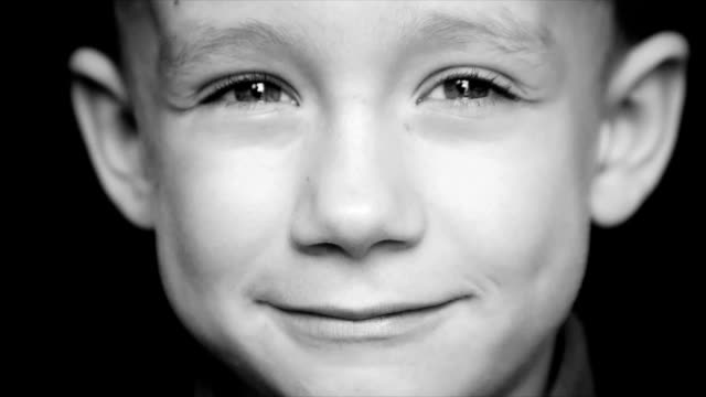 Portrait-of-a-boy-close-up-on-a-black-background