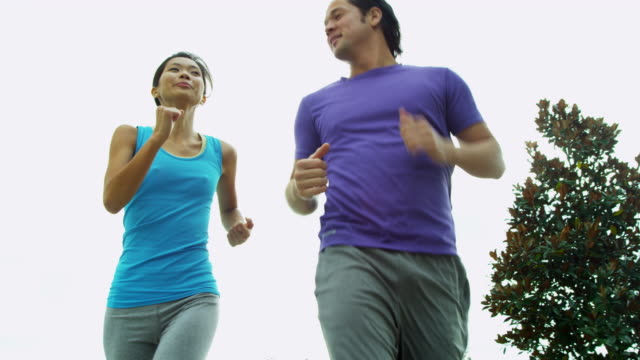 Happy-Ethnic-couple-enjoying-healthy-fitness-lifestyle-jogging