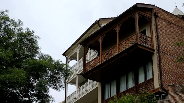 Traditional-wood-design-balcony-houses,-beautiful-exterior,-old-style-residence