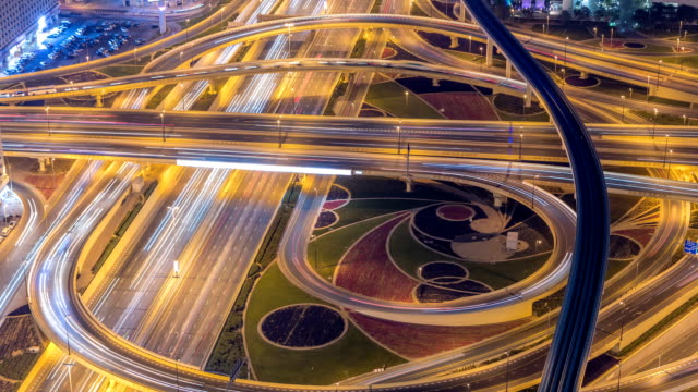 Night-traffic-on-a-busy-intersection-on-Sheikh-Zayed-highway-aerial-timelapse