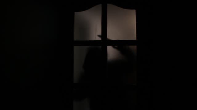 Horror.-Night.-Scary-silhouette-behind-the-door