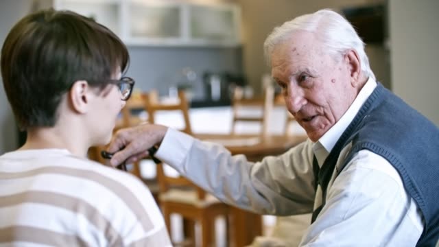 Young-Woman-Talking-with-Elderly-Man
