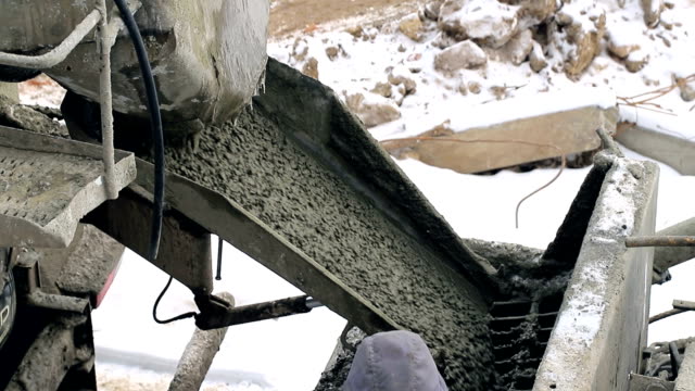 Cement-on-the-troughs-follows-from-the-concrete-mixer.-Construction-site