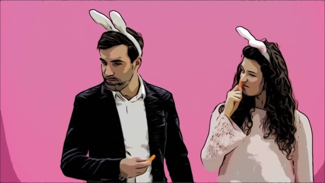Young-couple-standing-standing-on-pink-background.-During-this,-they-carry-out-the-movement-of-rabbits.-The-woman-put-her-hands-on-his-neck,-choking.-After-this,-you-are-genuinely-laughing.