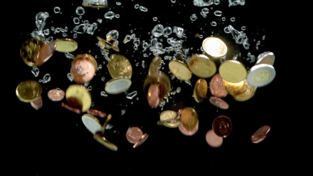 HD---Euro-coins-falling-into-water.-Slow-motion
