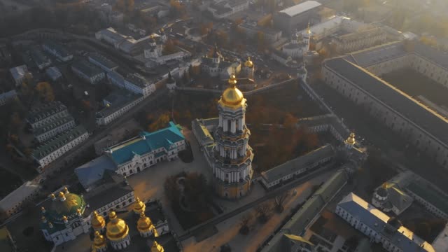 Bell-tower-Kiev-Pechersk-Lavra-at-sunset,-aerial