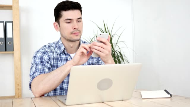Man-Using-Smartphone,-Browsing-Online