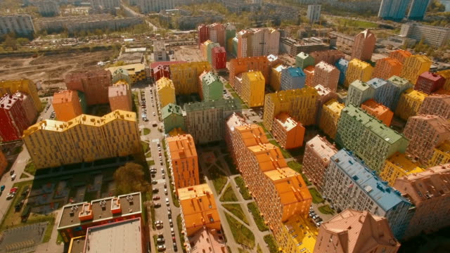 Flying-over-cozy-comfortable-colorful-buildings-in-a-European-city-4K-UHD-aerial