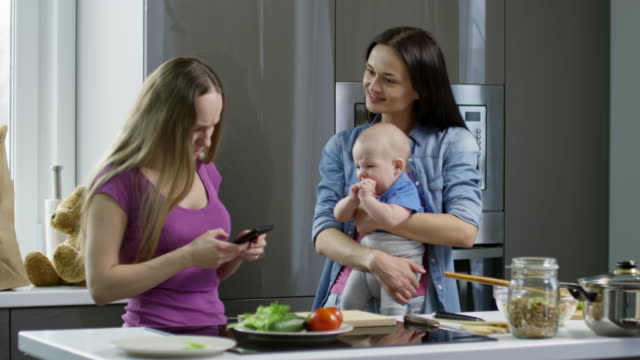 Women-with-Baby-Boy-in-Kitchen