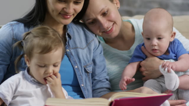 Happy-Mothers-Reading-Book-to-Children