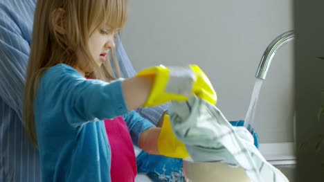 Girl-Wiping-Clean-Dishes-with-Cloth