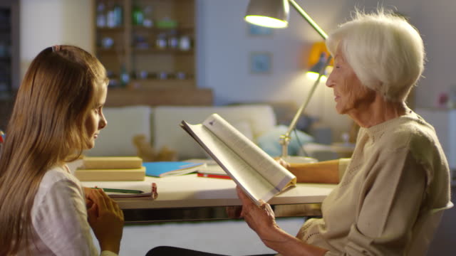 Grandma-Reading-Book-to-Girl