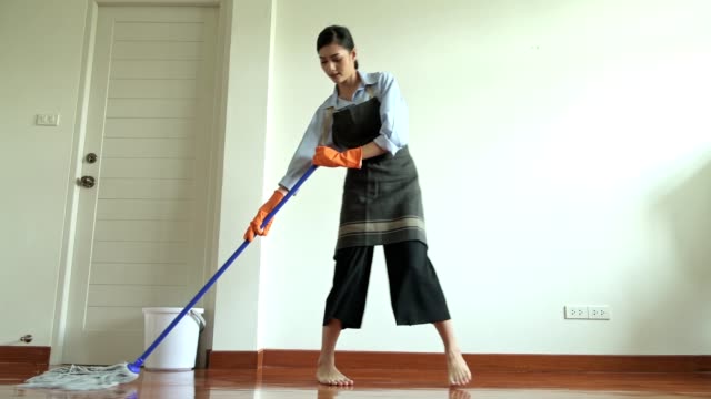 Woman-cleaning-house-with-a-mop.
