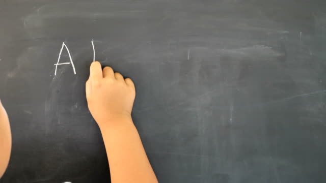 Hand-of-Boy-asian-children-write-the-chalkboard.-Education-concept.
