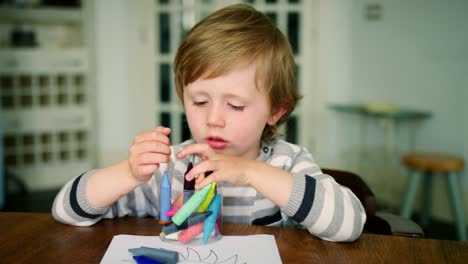 Young-Boy-Playing-With-Crayons