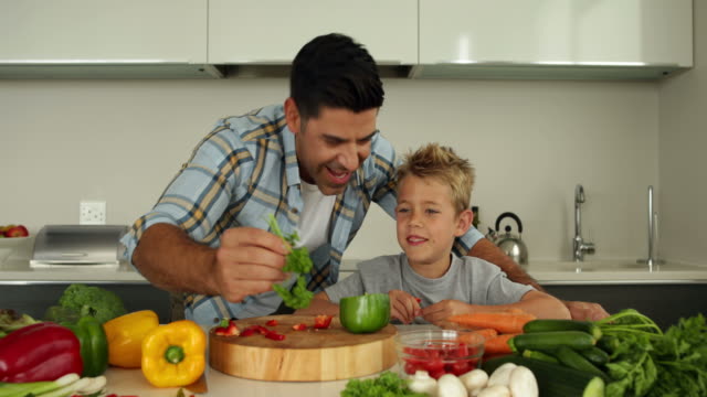 Father-showing-his-son-different-ingredients