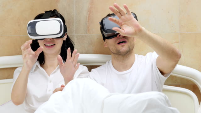 Couple-using-VR-glasses.