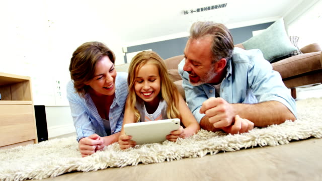 Family-using-digital-tablet-in-living-room