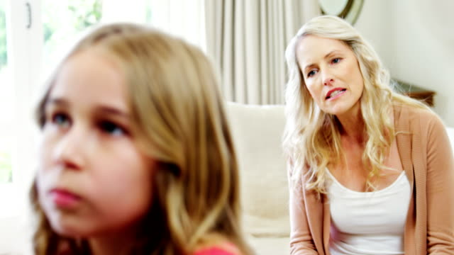 Mother-arguing-with-her-daughter-in-living-room