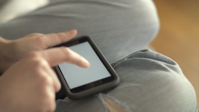 Closeup-Of-Woman-Scrolling-Screen-Of-Smartphone-At-Home