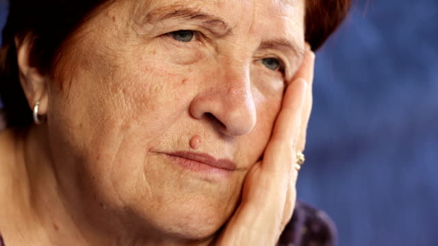 Pensive,worried-old-woman-close-up.-Portrait-of-sad-elderly-woman