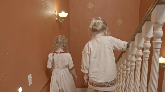 Little-Children-Walking-Down-Staircase
