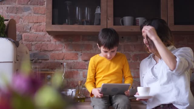 Happy-boy-playing-on-digital-tablet