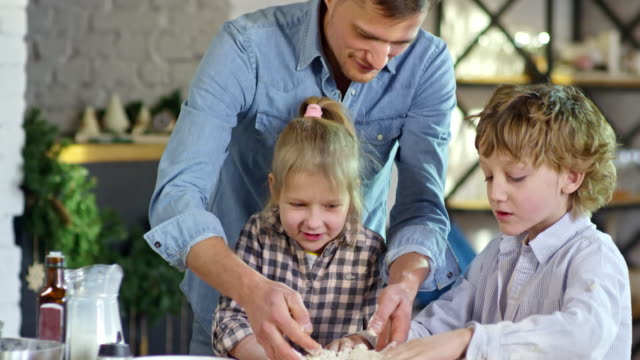 Father-Making-Pizza-Dough-with-Children