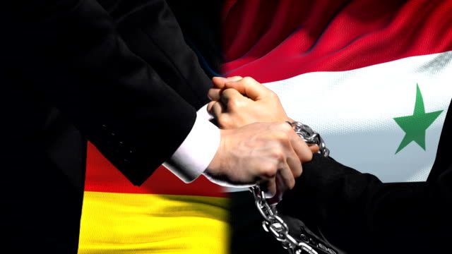 Germany-sanctions-Syria,-chained-arms,-political-or-economic-conflict,-trade-ban