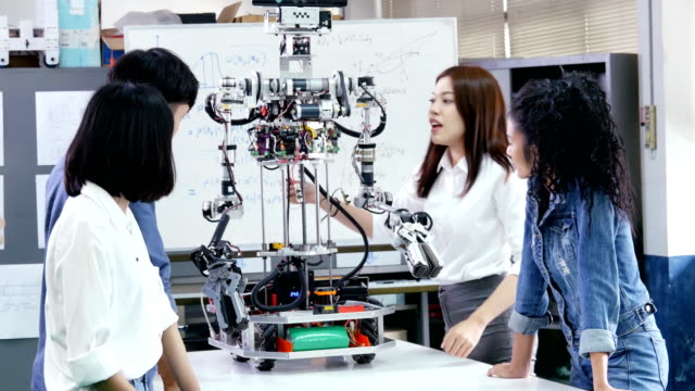 Female-engineer-present-project-with-team.-Team-engineer-start-up-for-robot-project-together.-People-with-technology-or-innovation-concept.-4K-Resolution.