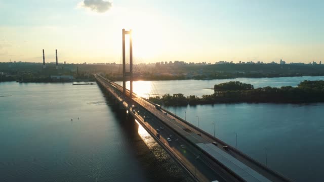 Aerial-drone-footage.-Fly-over-south-bridge-in-kyiv-at-sunset