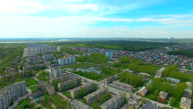 Drone-quadrocopter-flies-over-the-summer-city.-Greenery-in-the-city