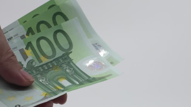 Slow-motion-Close-up-hands-counting-euros-bills-of-one-hundred.-Count-money