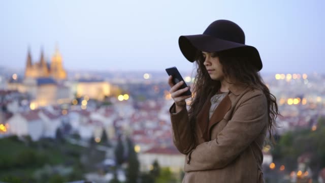 Girl-using-smartphone-in-twilight