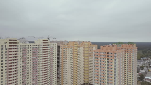 Aerial-view.-A-complex-of-new-high-rise-apartment-buildings-in-the-city.-The-camera-flies-to-the-houses