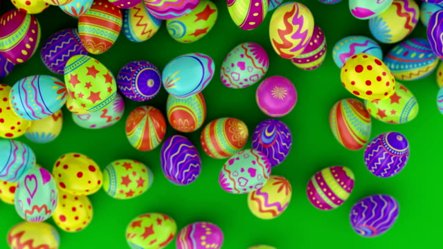 Coloridos-huevos-de-Pascua,-caen-en-el-marco-y-llenarlo-totalmente.-Fondo-verde.