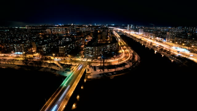 The-beautiful-view-on-the-evening-city-with-a-river.-time-lapse