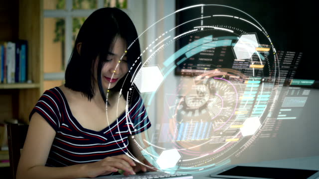 Young-Asian-Teenage-girl-using-on-a-holographic-computer-terminal