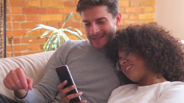 Couple-watching-online-content-on-smartphone