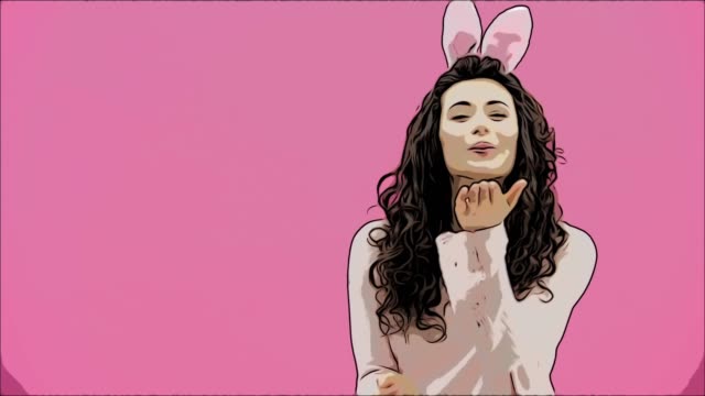 Beautiful-young-girl-standing-on-a-pink-background.-During-this,-there-are-ears-of-rabbits-on-the-head.-Watching-the-camera-smiles-and-shows-gestures-of-air-kisses.-Easter.-Animation.