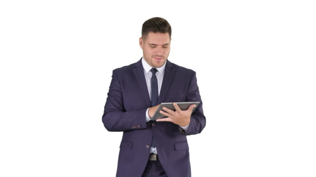 Businessman-swiping-pages-on-a-tablet-and-talking-to-camera-explaining-something-while-walking-on-white-background